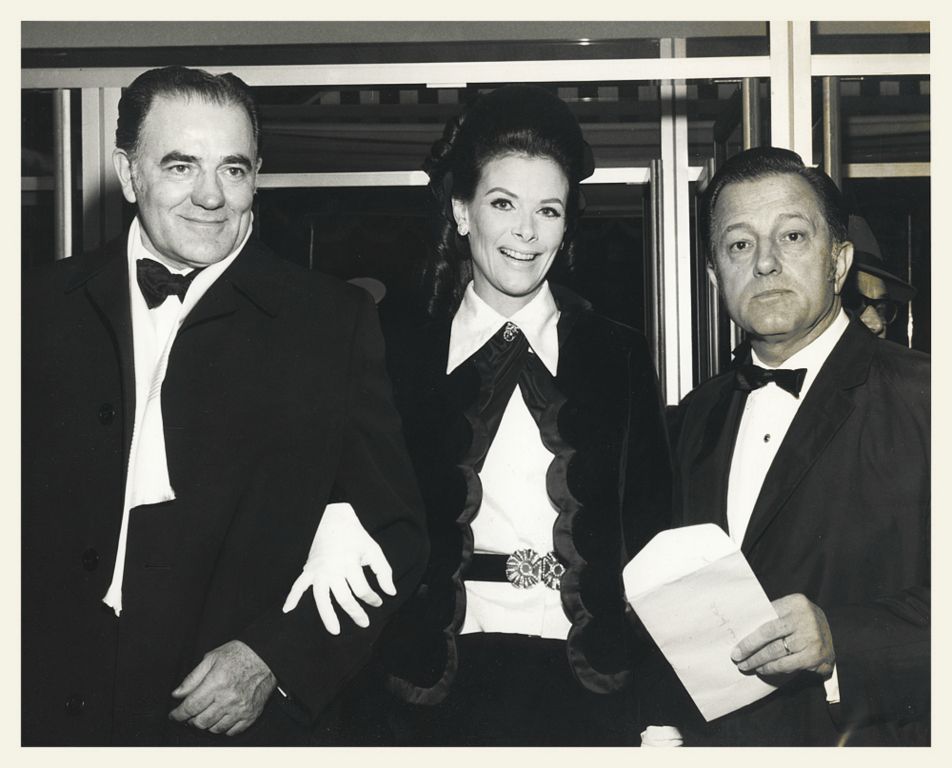 Louis and Kathy L'Amour along with Director Edward Dmytryk at the Royal Command Performance of the movie SHALAKO.